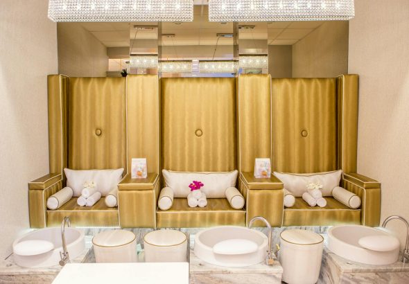 Elegant and contemporary spa interior featuring luxurious pedicure stations for relaxation.